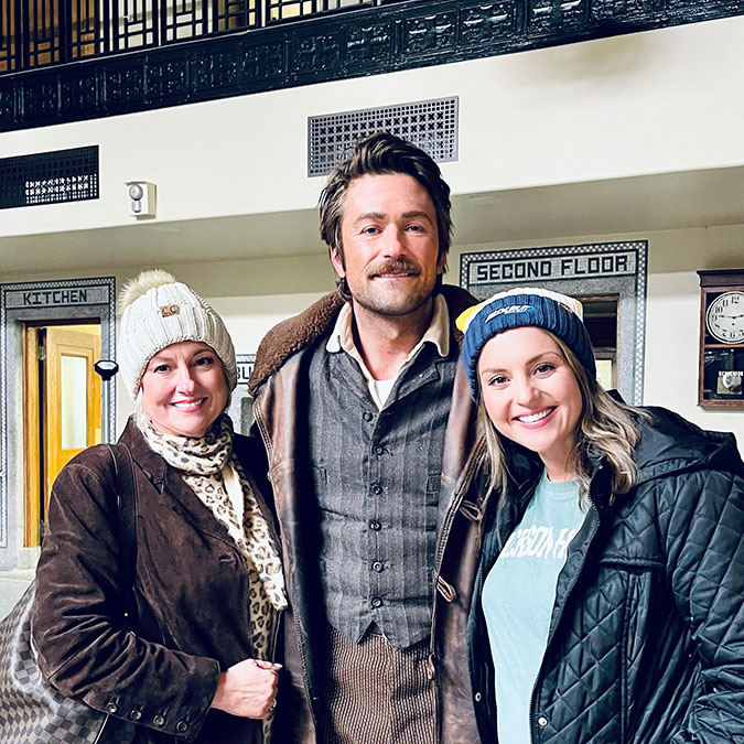BNSF Director of External Communications Kendall Sloan, right, with her mother, Stacey Kirkham, and Brandon Sklenar, who plays Spencer Dutton in “1923”  BNSF Director of External Communications Kendall Sloan, right, with her mother, Stacey Kirkham, and Brandon Sklenar, who plays Spencer Dutton in “1923”