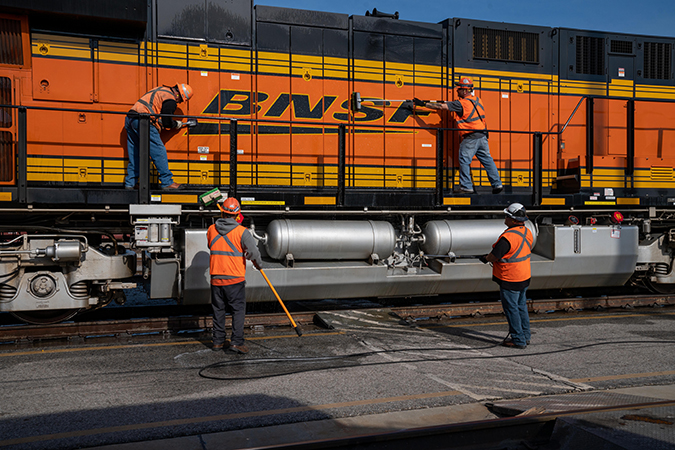 Employees clean a locomotive in San Bernardino, California.