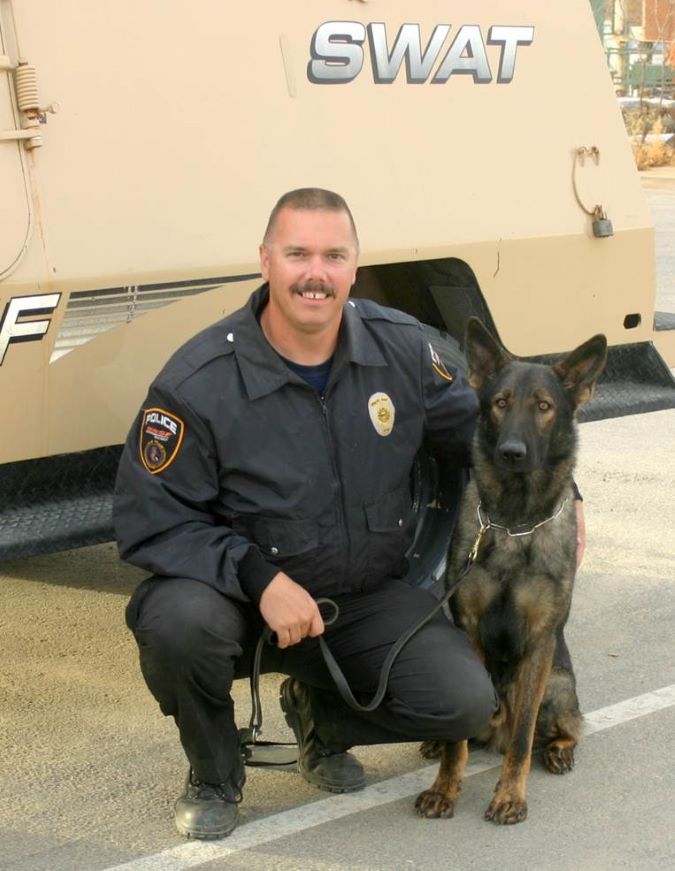 Schaffer and Faust near a SWAT vehicle.  Schaffer and Faust near a SWAT vehicle.