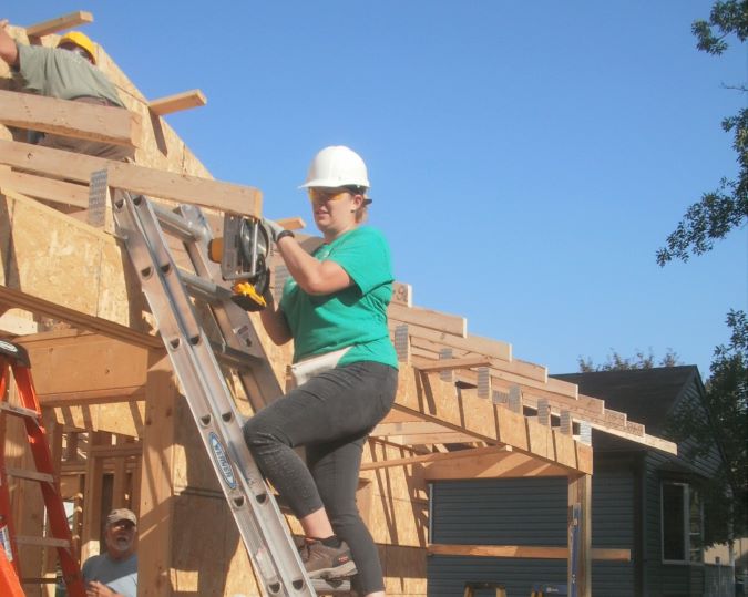 Butenas sawing wood.  Butenas sawing wood.