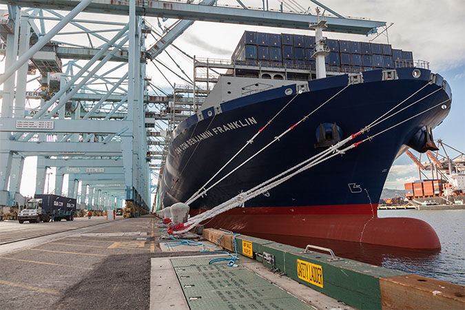Unloading of docked container ship at Port of Los Angeles  Unloading of docked container ship at Port of Los Angeles