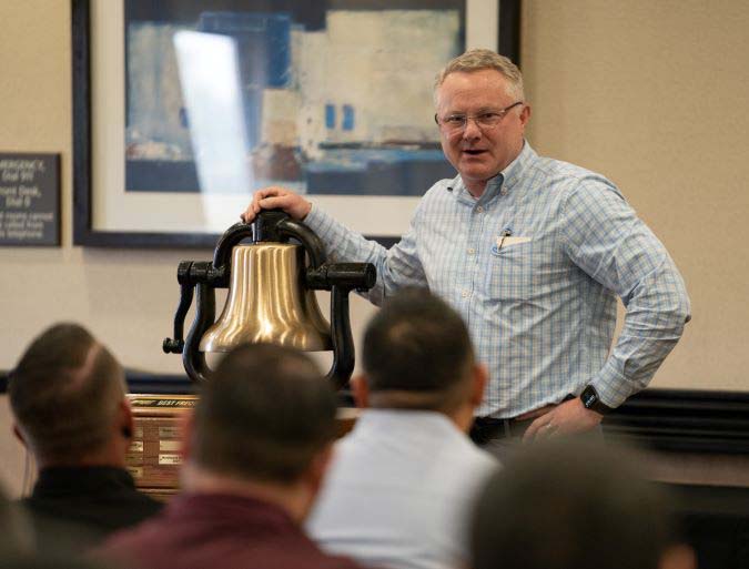 Executive Vice President and Chief Operations Officer Matt Igoe at a bell presentation.  Executive Vice President and Chief Operations Officer Matt Igoe at a bell presentation.