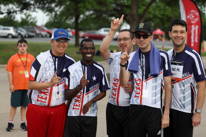 Special Olympics athletes celebrating their wins.  Special Olympics athletes celebrating their wins.